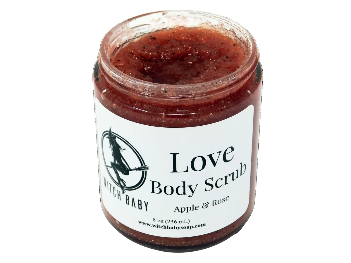 A jar of Love Body Scrub with apple and rose scents, packaged in a clear glass jar with a label that reads 'Love Body Scrub Apple & Rose'.