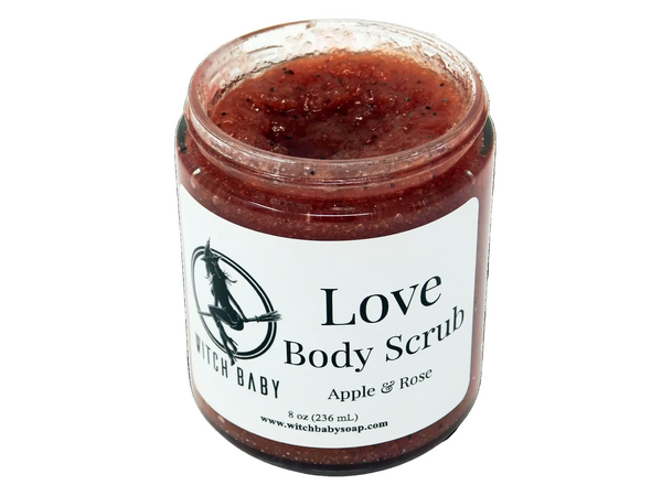 A jar of Love Body Scrub with apple and rose scents, packaged in a clear glass jar with a label that reads 'Love Body Scrub Apple & Rose'.