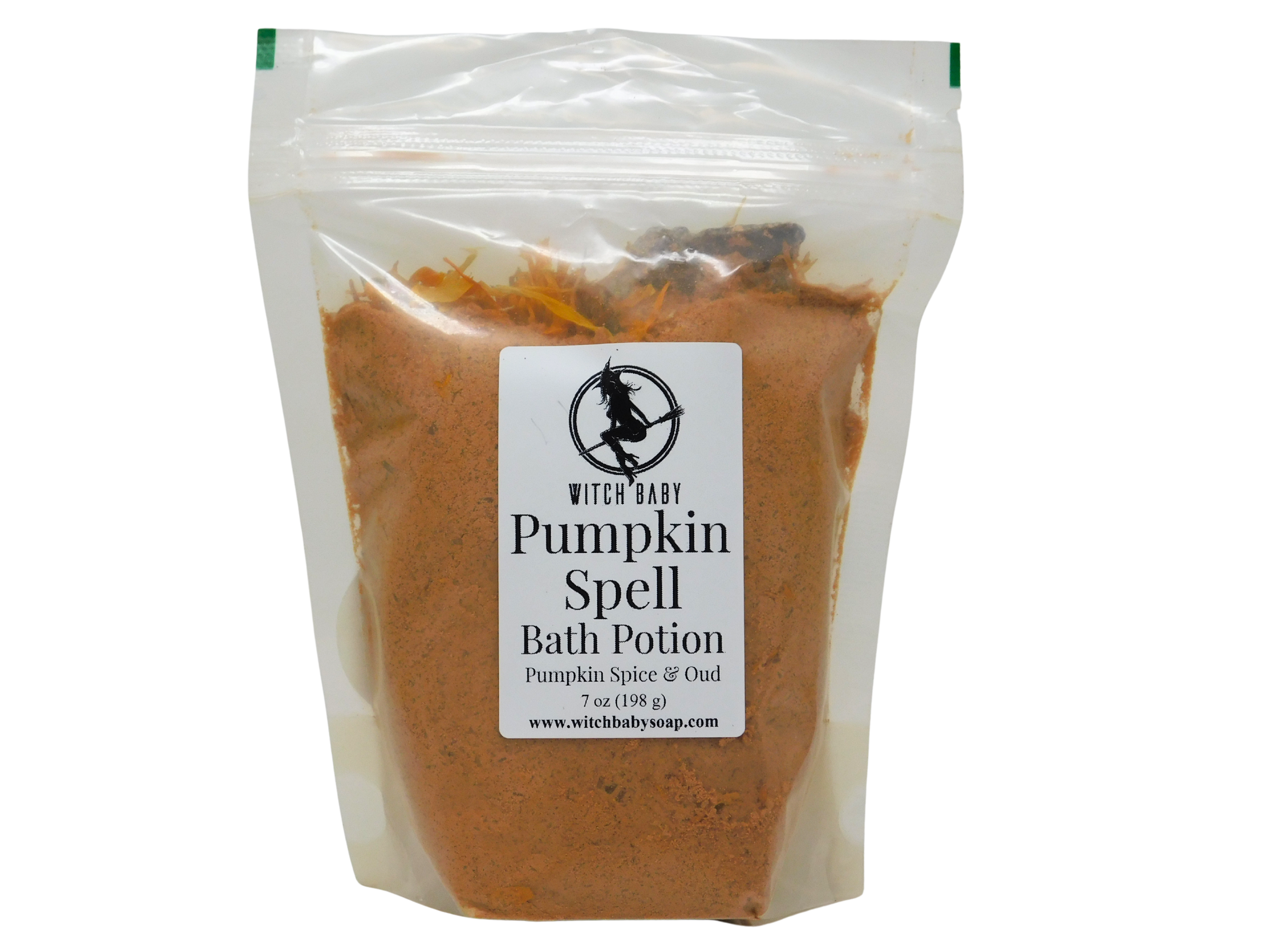 Pumpkin Spell Bath Potion in a clear biodegradable standup bag with Witch Baby label showing Pumpkin Spice and Oud scent, filled with warm orange pumpkin and clay powder, 7 oz