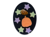 Pumpkin Spell Soap top-down view - black oval soap with purple and green glow star embeds, an orange pumpkin soap embed, and a tumbled fire agate crystal on a white background