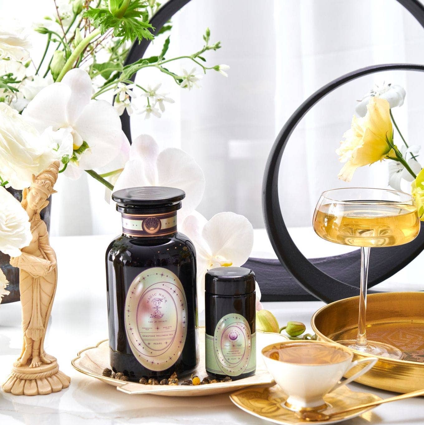 A tasteful arrangement of teas, flowers, and beautiful little trinkets