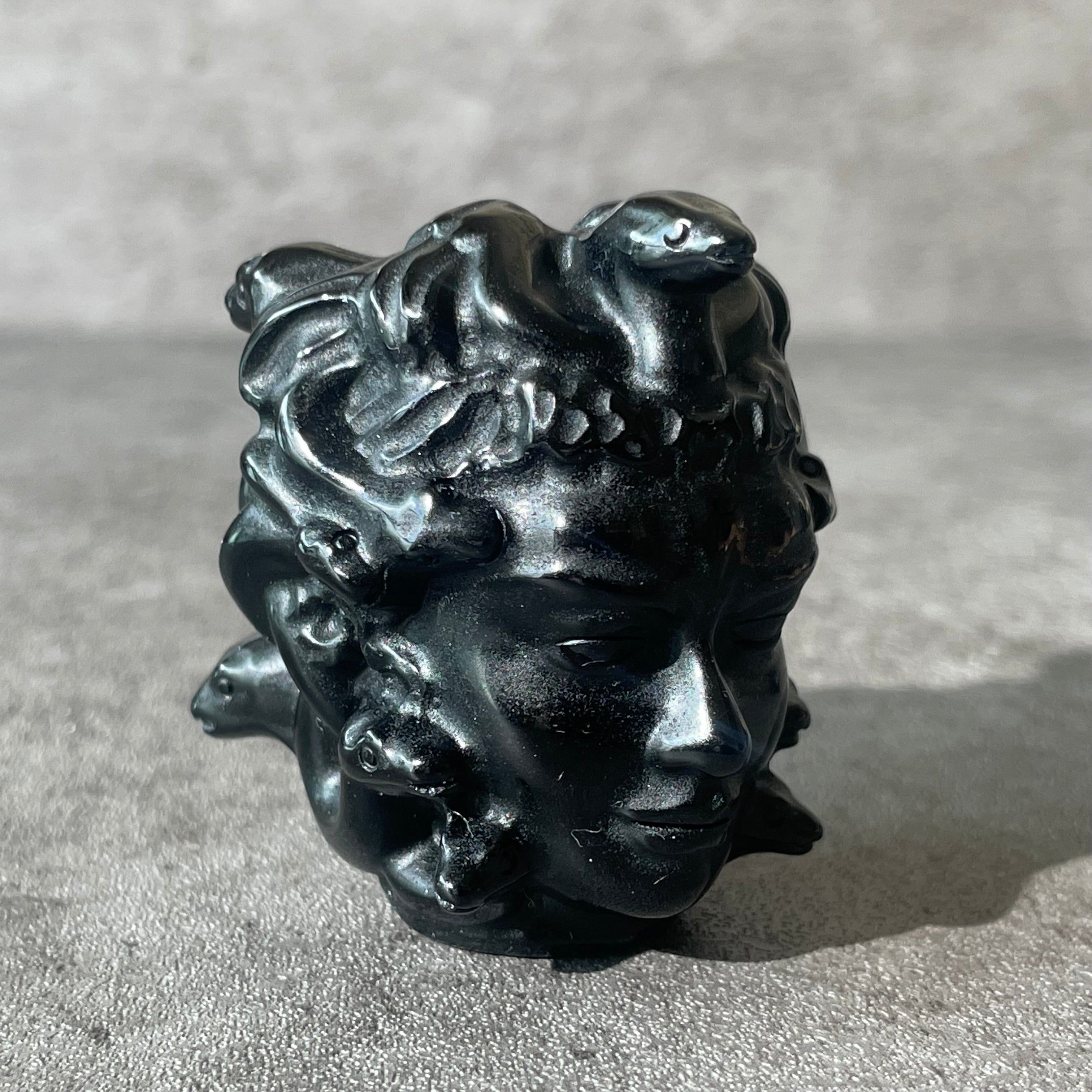 Black obsidian Medusa head, looking right