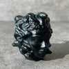 Black obsidian Medusa head, looking right