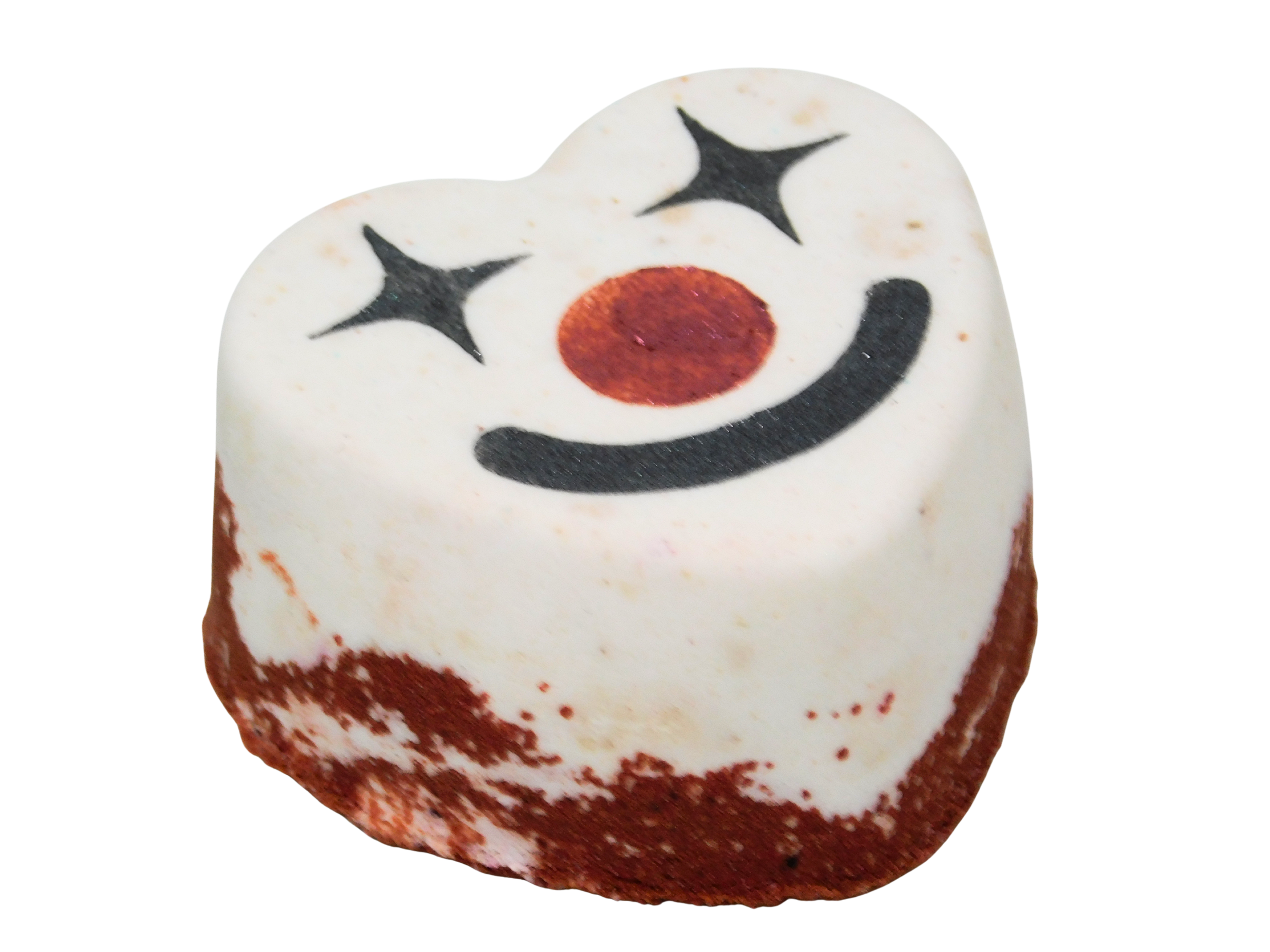 Funhouse Bath Fizz angled view showing the heart shape with red glittered base, white top, and clown face with sparkle eyes, red nose, and black smile