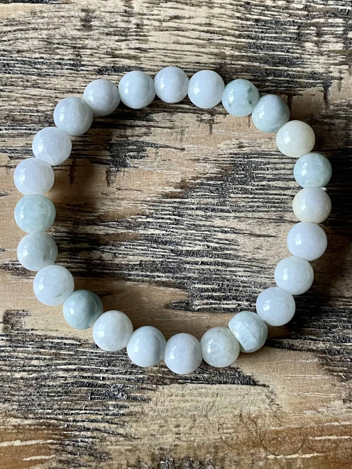 Soft creamy green Burma Jade beads on a stretch bracelet