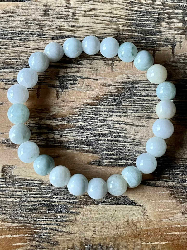 Soft creamy green Burma Jade beads on a stretch bracelet