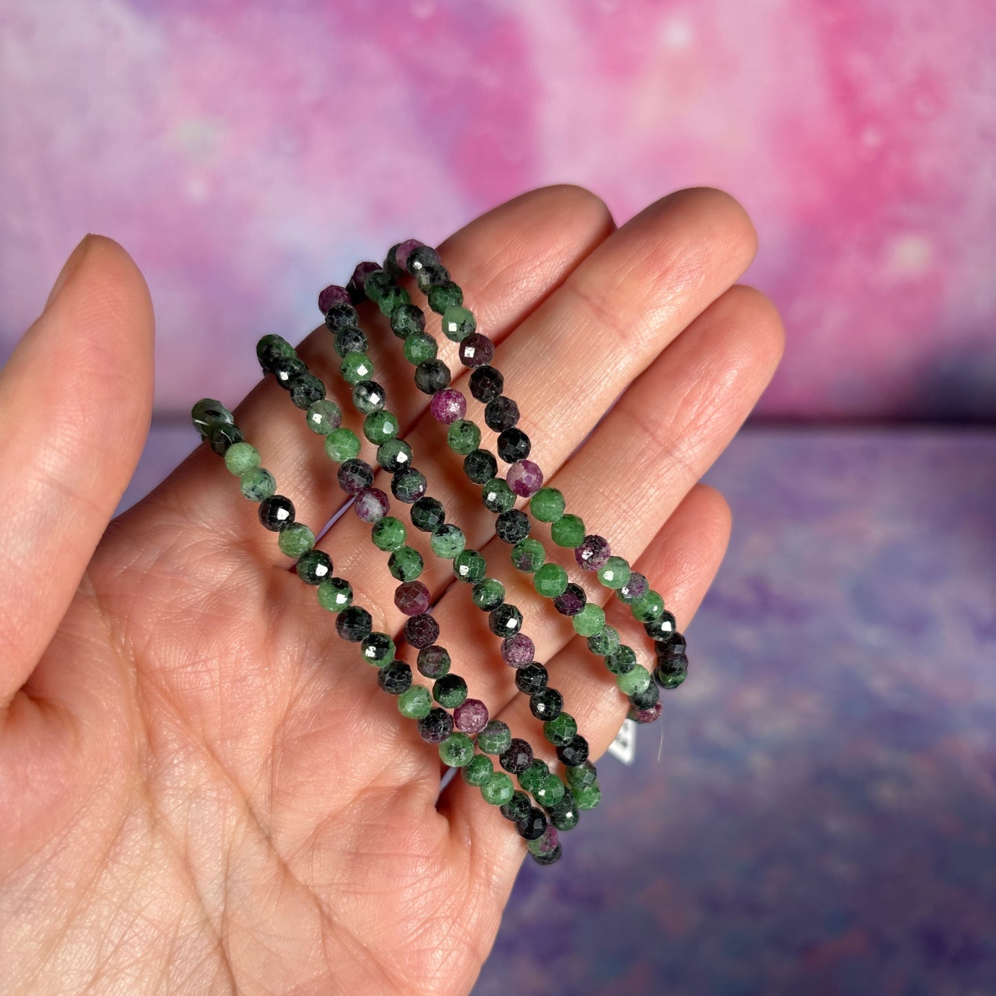 Petite bracelets held by a hand