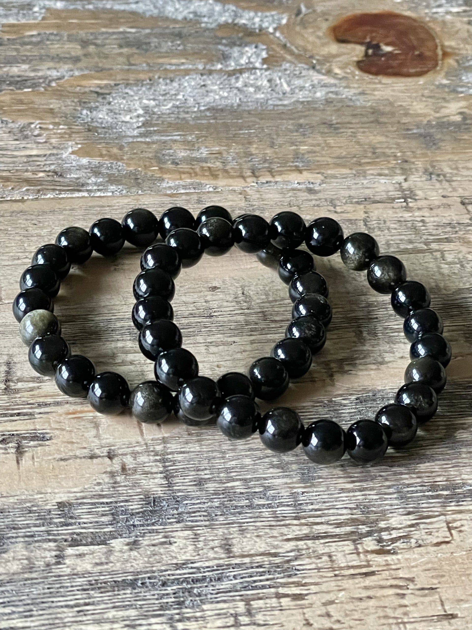 Two gold sheen obsidian bracelets