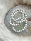 Howlite bracelets sitting on an agate and fur