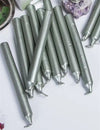 Silver chime candles laid out in a row