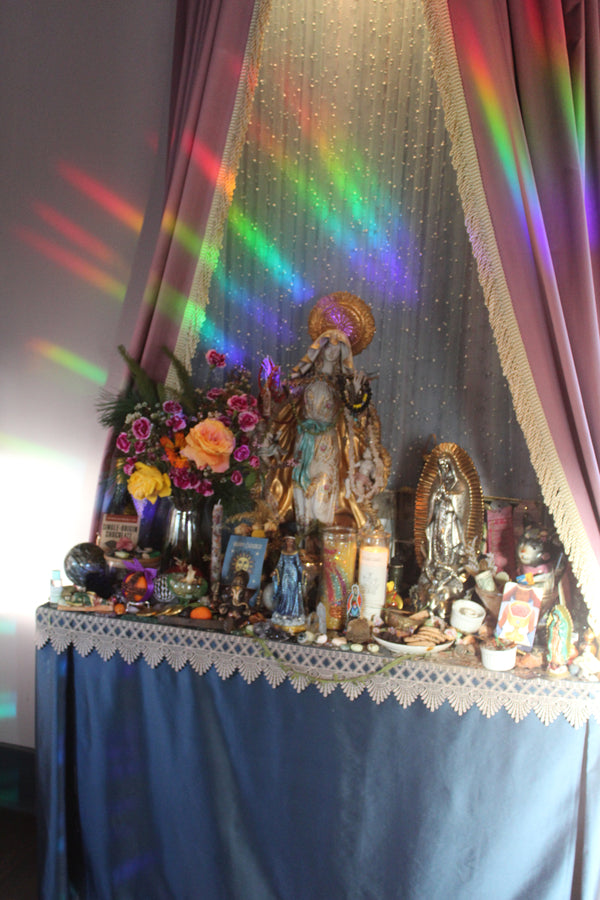 Our beautiful altar with rainbows cast upon it from the setting sun