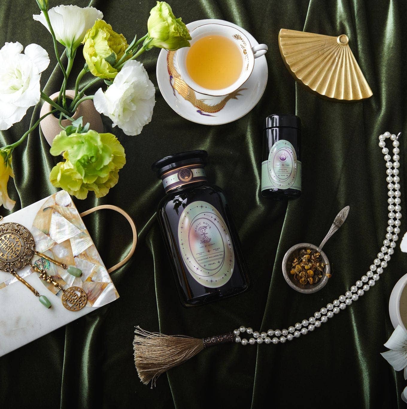 A tasteful arrangement of teas, flowers, and beautiful little trinkets