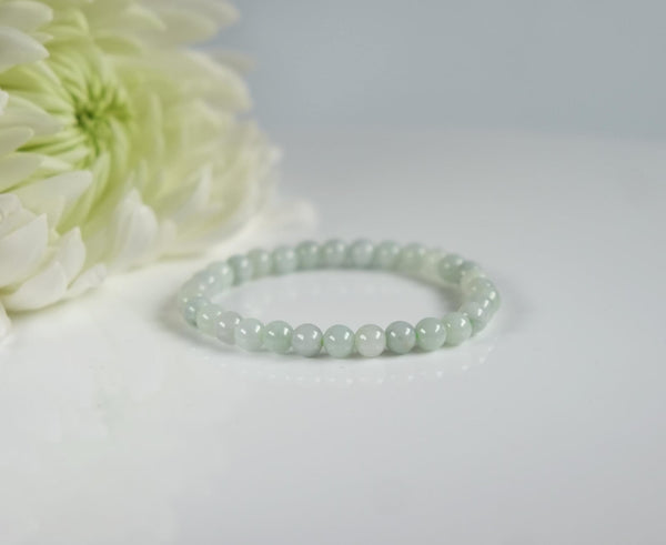 A single, petite bracelet with creamy green stone 4mm burma jade beads