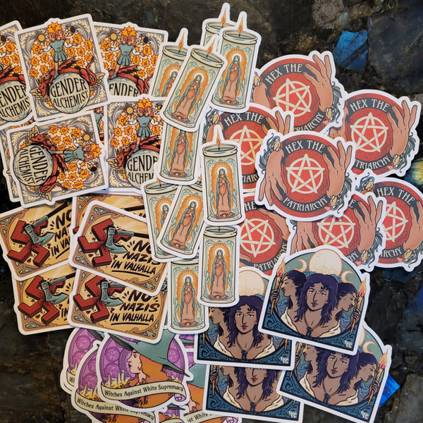 A collection of various colorful stickers with different designs, including text and illustrations related to themes of gender, magic, antifascism, and feminism.